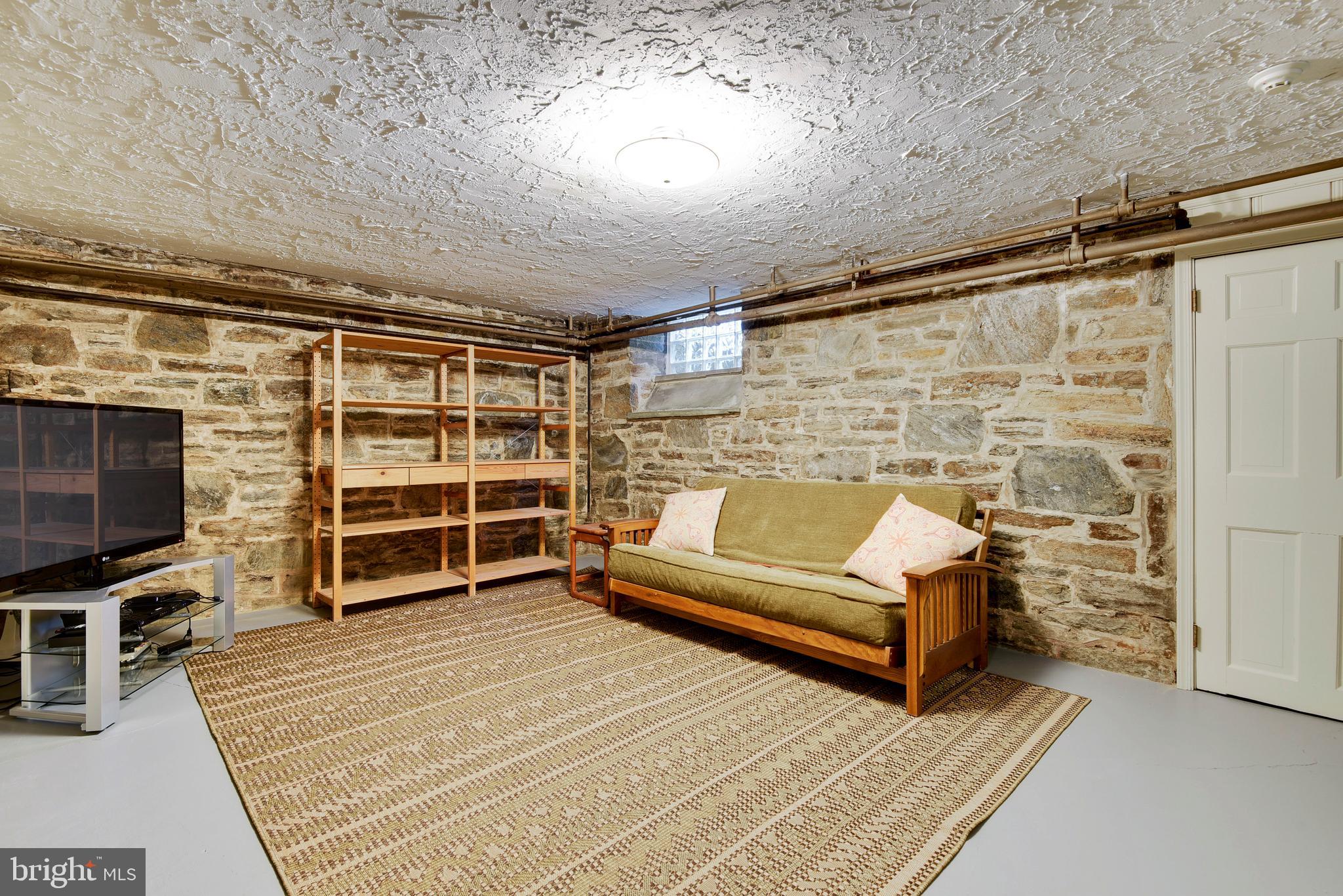 4127 Westview Road Baltimore, MD 21218 - Photo 31 of 43 Lower level family room w/ stone walls
