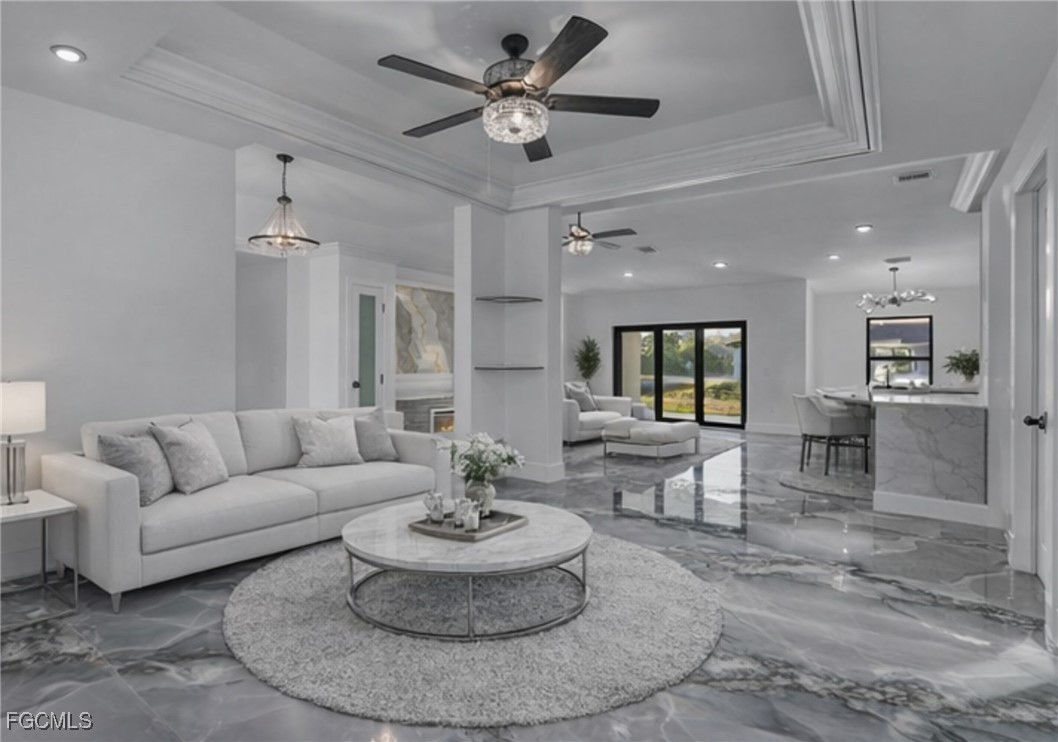 2901 2nd Street Southwest Lehigh Acres, FL 33976 - Photo 11 of 40 a living room with furniture and a dining table with kitchen view