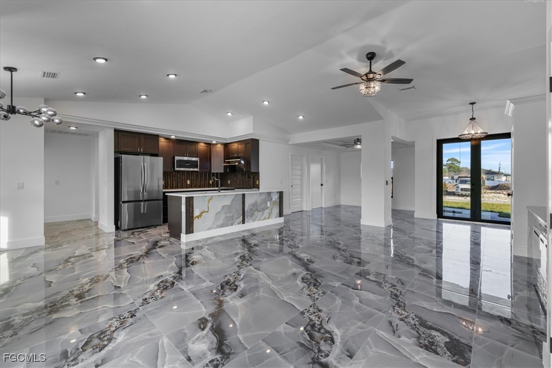 2901 2nd Street Southwest Lehigh Acres, FL 33976 - Photo 13 of 40 a view of a kitchen with a sink and stainless steel appliances