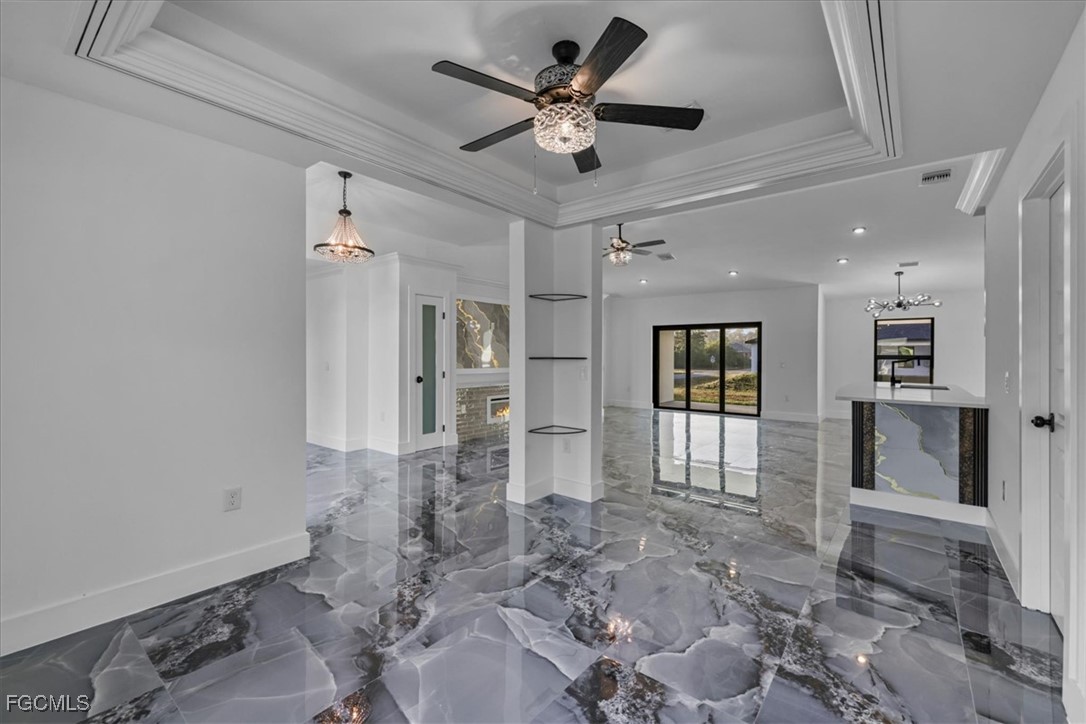 2901 2nd Street Southwest Lehigh Acres, FL 33976 - Photo 15 of 40 a view of empty room with wooden floor and fan
