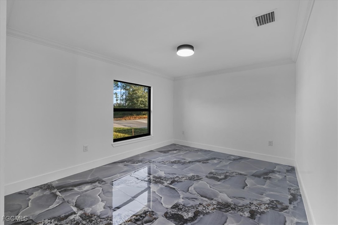 2901 2nd Street Southwest Lehigh Acres, FL 33976 - Photo 29 of 40 an empty room with windows