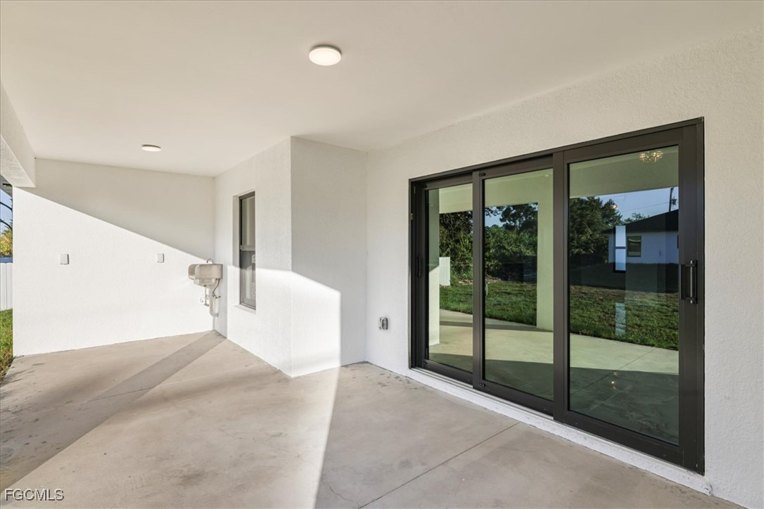 2901 2nd Street Southwest Lehigh Acres, FL 33976 - Photo 35 of 40 a view of a living room and front door