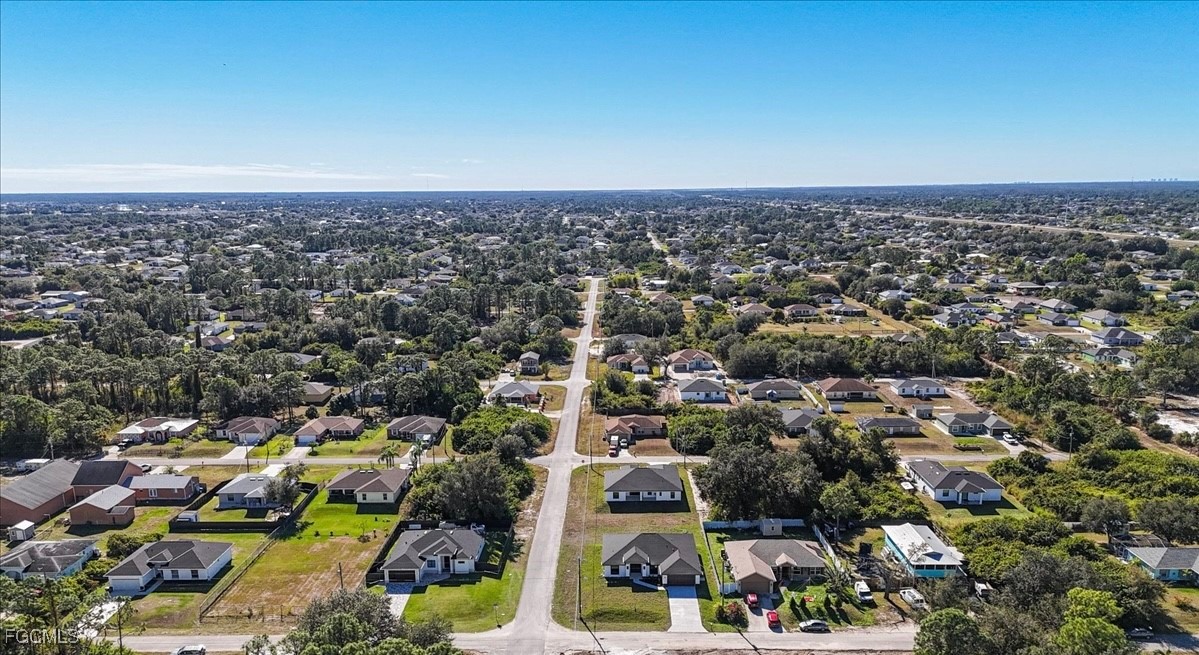 2901 2nd Street Southwest Lehigh Acres, FL 33976 - Photo 37 of 40 an aerial view of a city with lots of residential buildings
