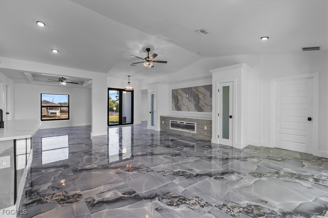 2901 2nd Street Southwest Lehigh Acres, FL 33976 - Photo 4 of 40 a view of a livingroom with furniture and chandelier