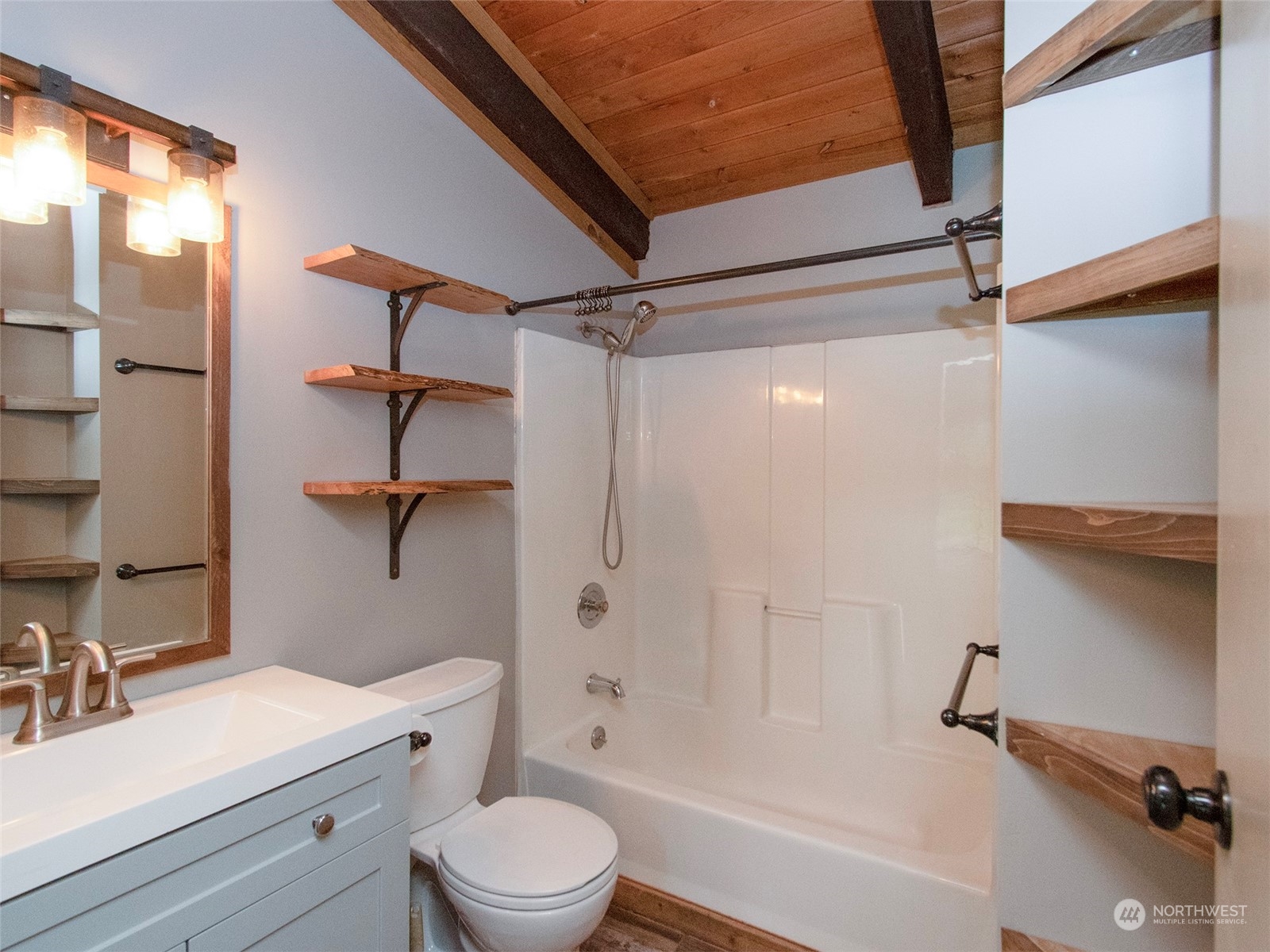 253 Sylvan Ridge Road Sequim, WA 98382 - Photo 15 of 40 a bathroom with a sink mirror bathtub and toilet