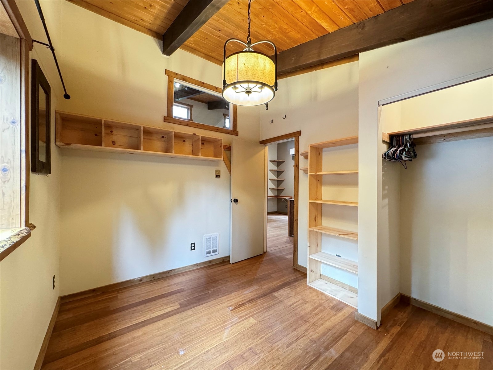 253 Sylvan Ridge Road Sequim, WA 98382 - Photo 19 of 40 a view of a hallway with wooden floor and staircase