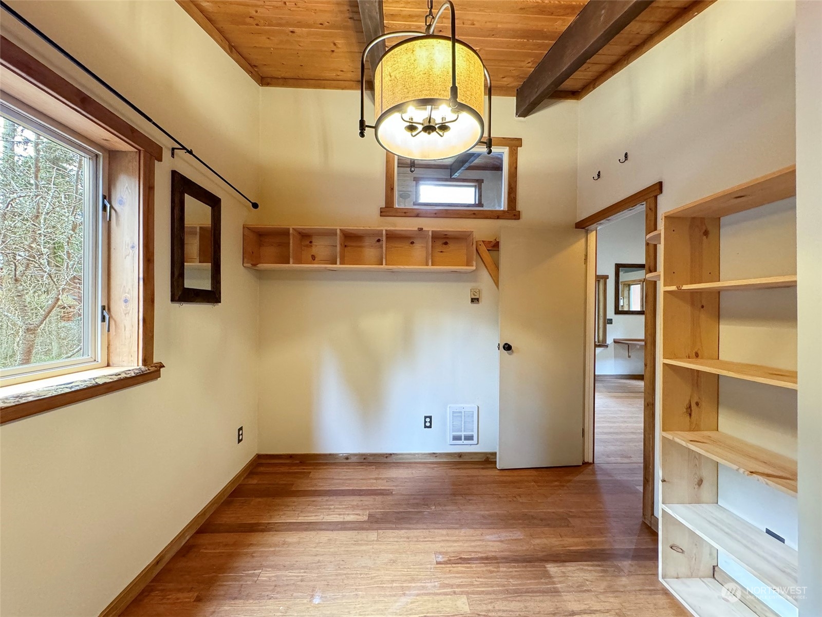 253 Sylvan Ridge Road Sequim, WA 98382 - Photo 20 of 40 a view of a hallway with wooden floor and a large window