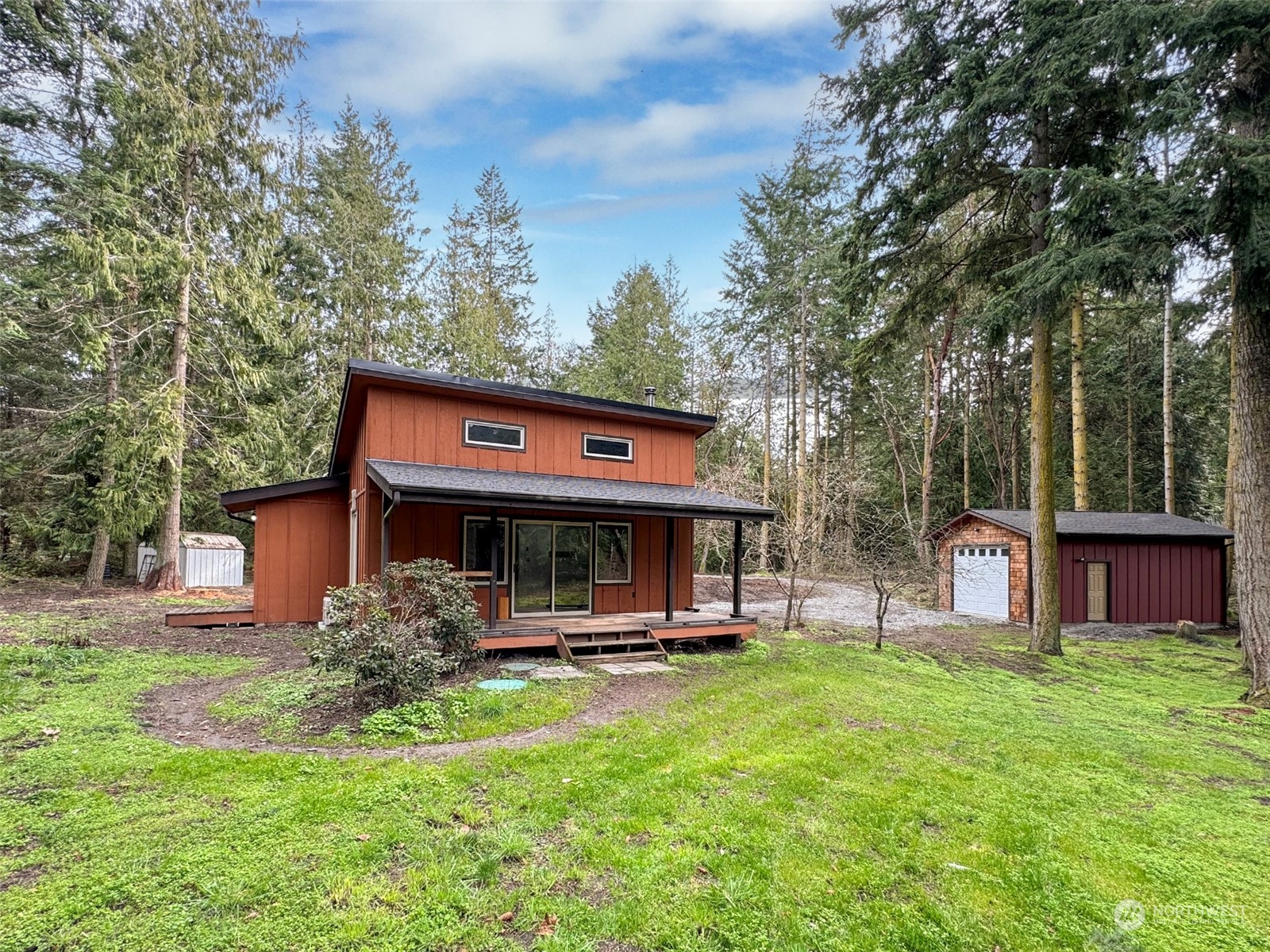 253 Sylvan Ridge Road Sequim, WA 98382 - Photo 25 of 40 a view of a house with a yard porch and sitting area