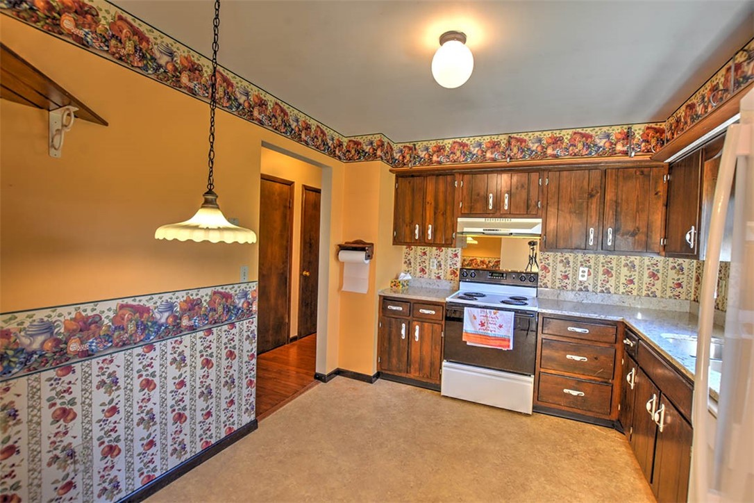 3441 Ferris Drive Decatur, IL 62521 - Photo 13 of 30 a kitchen with stainless steel appliances granite countertop a stove a sink and a refrigerator