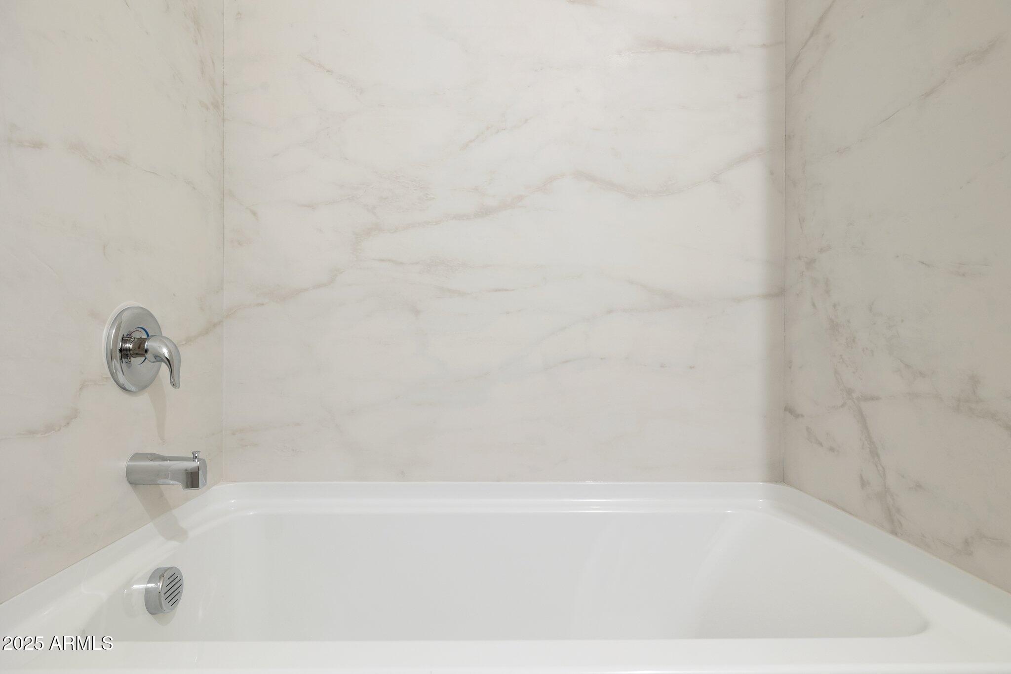 25434 West Fraktur Road Buckeye, AZ 85326 - Photo 11 of 14 a bathroom with a bathtub