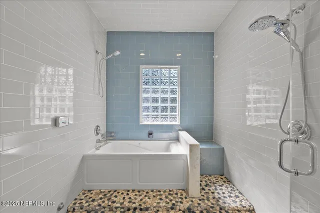 a bedroom with a bed and a television