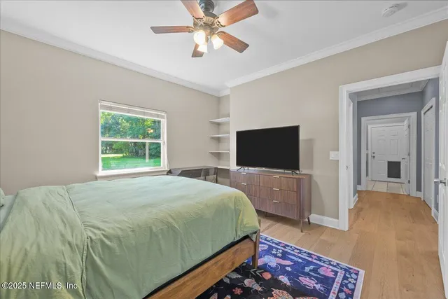 an aerial view of a house with swimming pool and garden