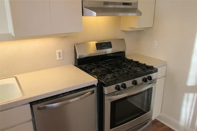 a bathroom with a tub and window