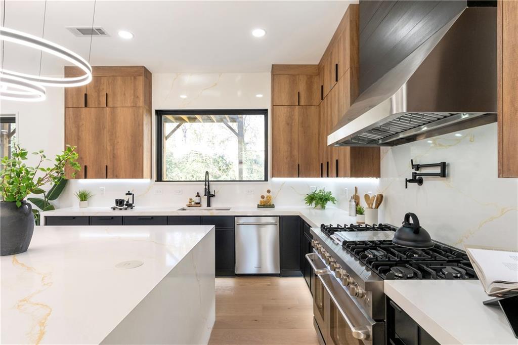 2986 San Jose Drive Decatur, GA 30032 - Photo 16 of 71 a kitchen with stainless steel appliances granite countertop a sink stove and refrigerator