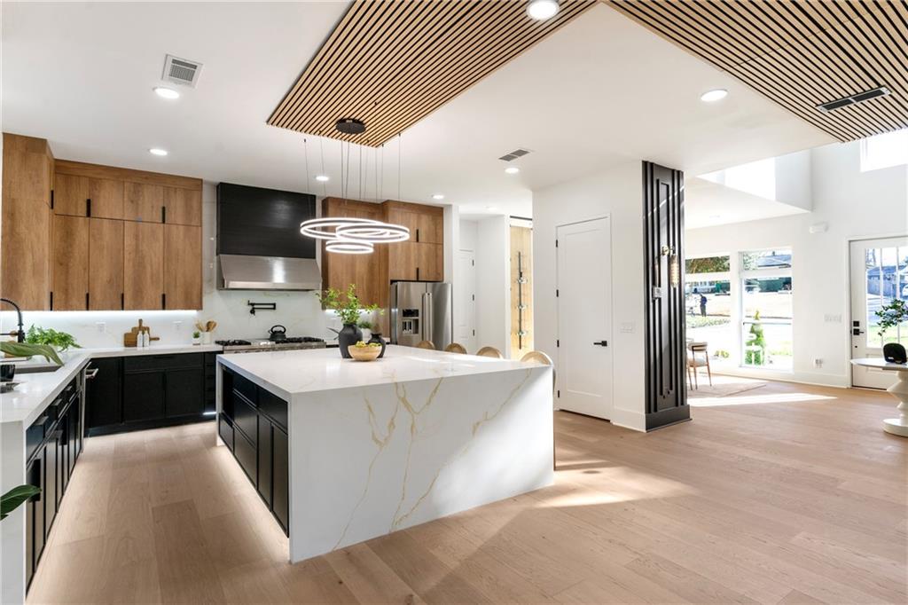 2986 San Jose Drive Decatur, GA 30032 - Photo 20 of 71 a kitchen with kitchen island stainless steel appliances a sink stove and cabinets