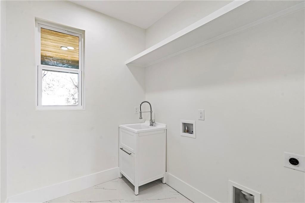 2986 San Jose Drive Decatur, GA 30032 - Photo 36 of 71 a bathroom with a sink a vanity and a mirror