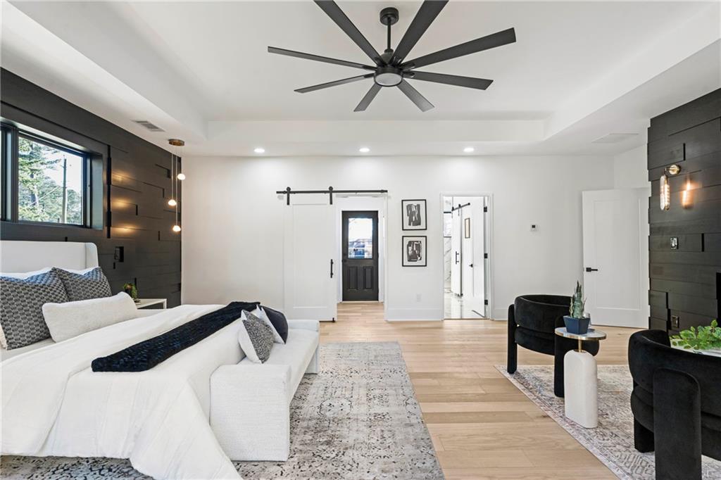 2986 San Jose Drive Decatur, GA 30032 - Photo 46 of 71 a large bedroom with a bed and a chandelier