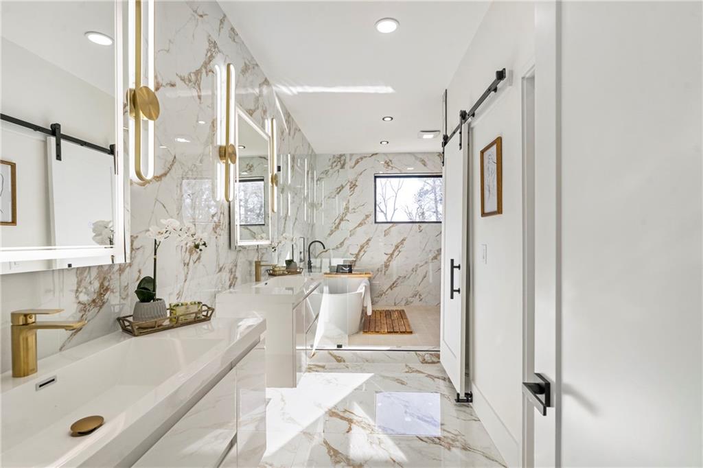 2986 San Jose Drive Decatur, GA 30032 - Photo 51 of 71 a bathroom with a tub sink and mirror