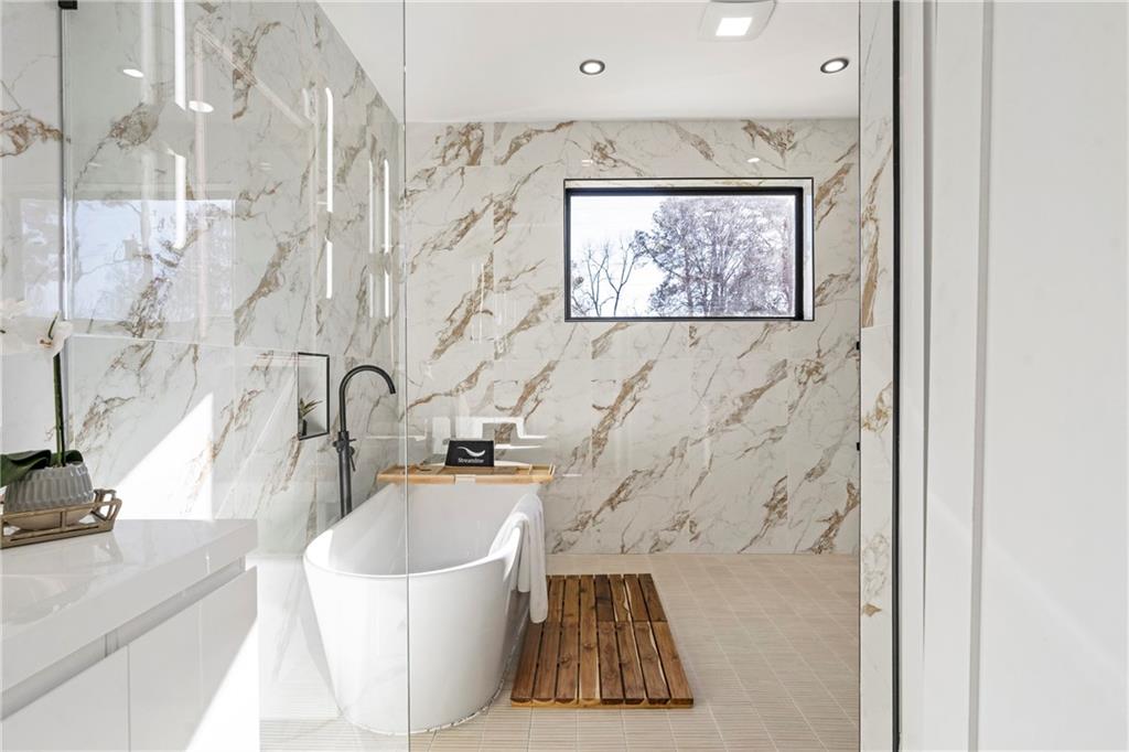 2986 San Jose Drive Decatur, GA 30032 - Photo 53 of 71 a bathroom with a sink a mirror and a bathtub
