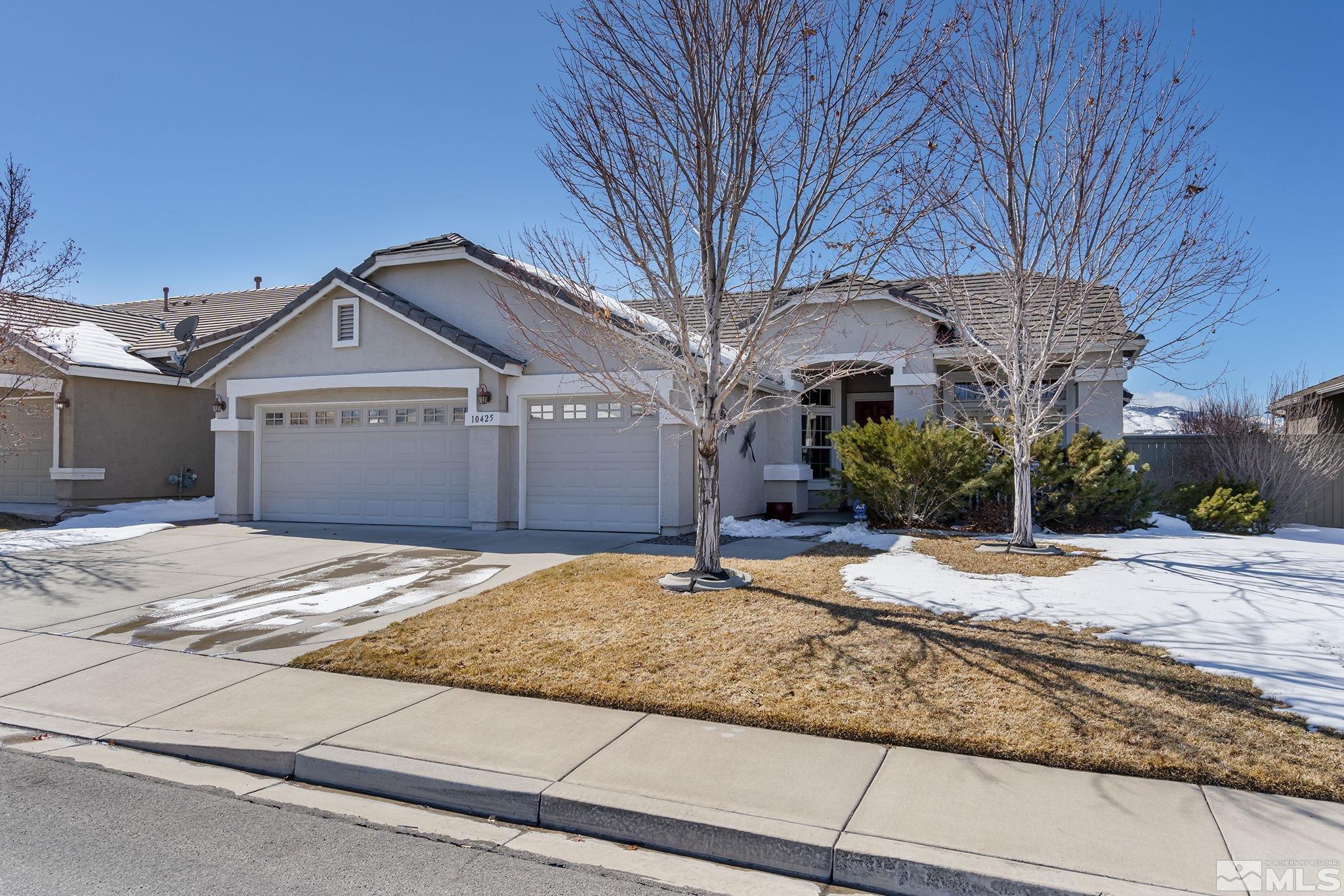 10425 Chantilly Way Reno, NV 89521 - Photo 1 of 33 a front view of a house with a yard and garage