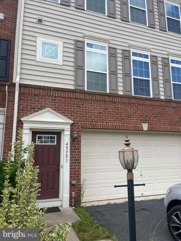 a front view of a house with parking