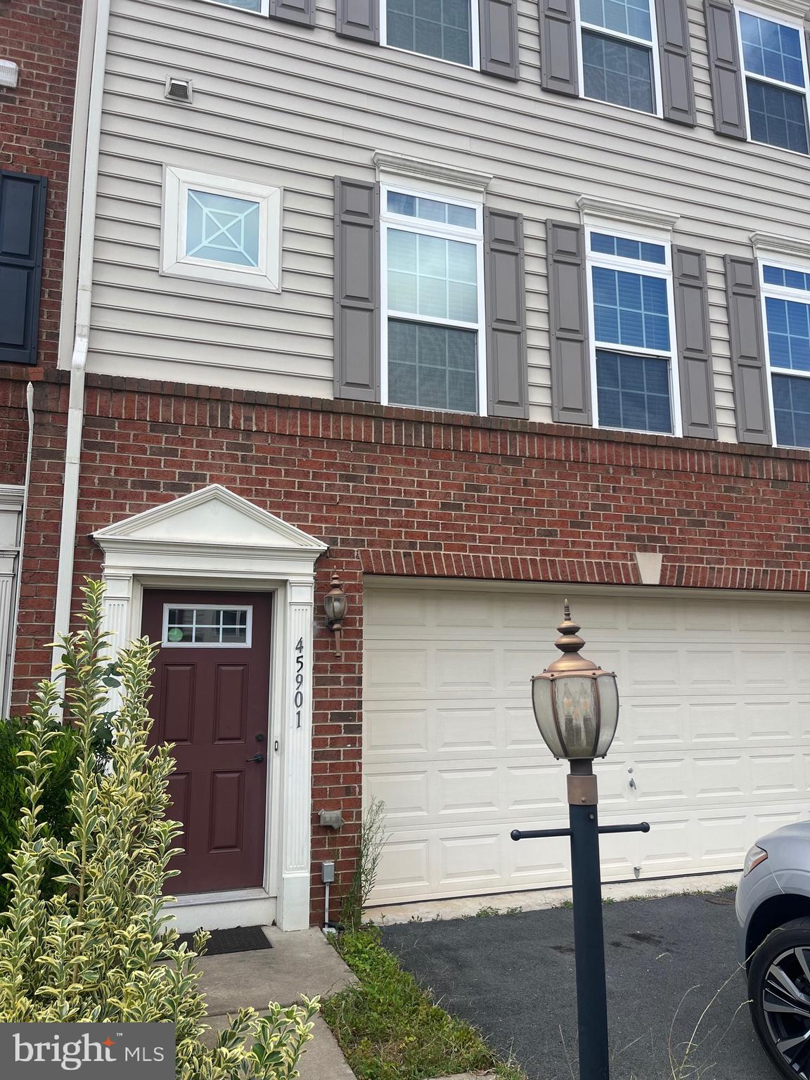 a front view of a house with parking