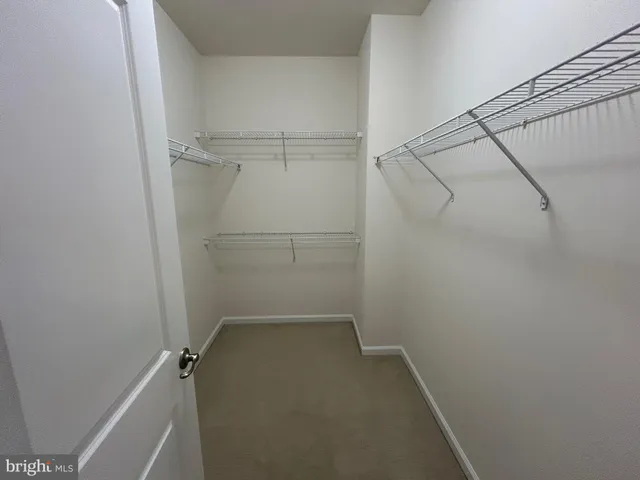 a view of a room with racks on the wall