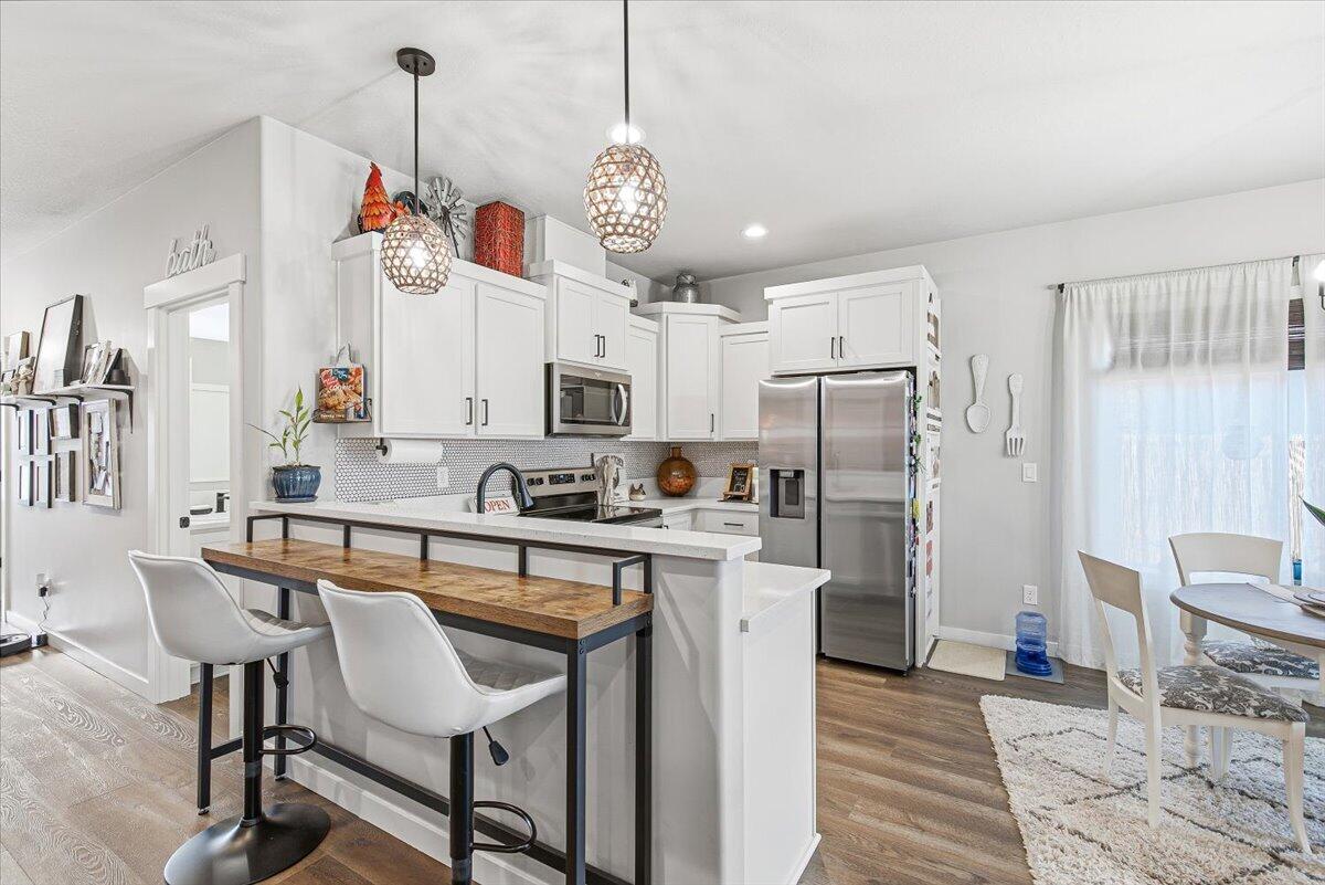 248 Christopher Way Talent, OR 97540 - Photo 5 of 33 a view of kitchen with cabinets and wooden floor