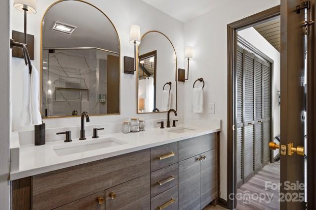 105 Beechtop Road Beech Mountain, NC 28604 - Photo 11 of 42 a bathroom with a double vanity sink and a mirror