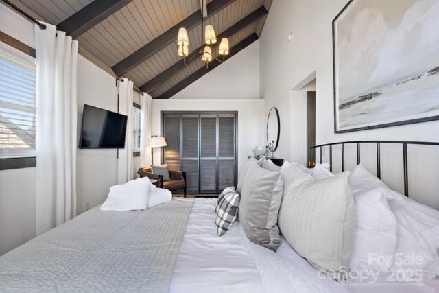 105 Beechtop Road Beech Mountain, NC 28604 - Photo 12 of 42 a bed room with a bed and a flat screen tv