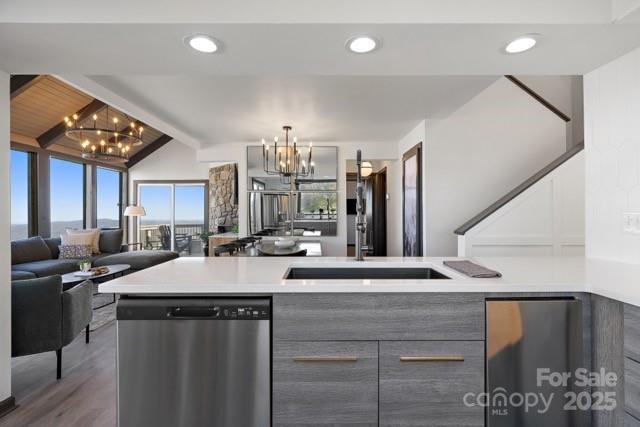 105 Beechtop Road Beech Mountain, NC 28604 - Photo 16 of 42 a kitchen with stainless steel appliances kitchen island granite countertop a sink and a stove