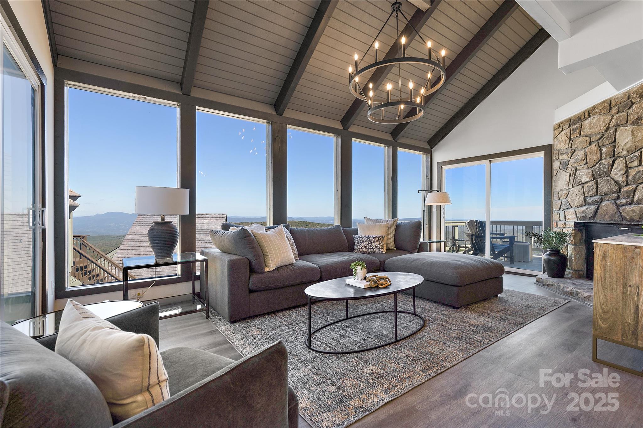105 Beechtop Road Beech Mountain, NC 28604 - Photo 2 of 42 a living room with furniture and a large window