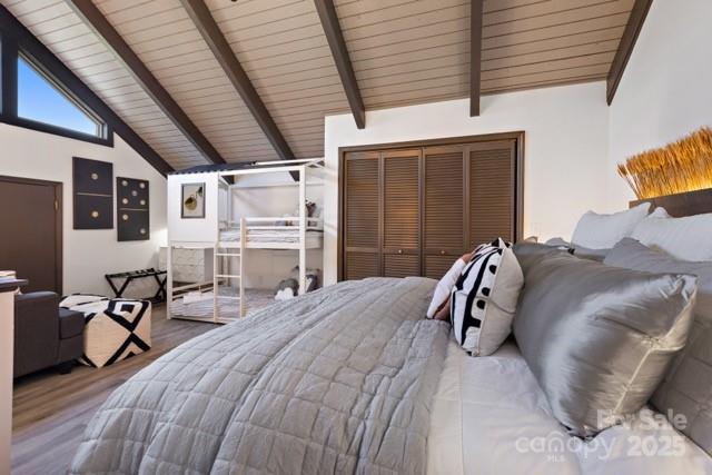 105 Beechtop Road Beech Mountain, NC 28604 - Photo 24 of 42 a bed room with a bed and a chair