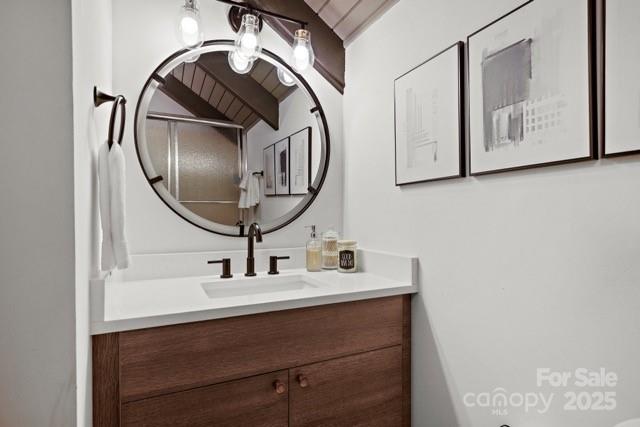 105 Beechtop Road Beech Mountain, NC 28604 - Photo 27 of 42 a bathroom with a sink and a mirror