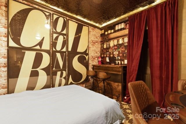 105 Beechtop Road Beech Mountain, NC 28604 - Photo 30 of 42 a bedroom with a bed chair and a large window