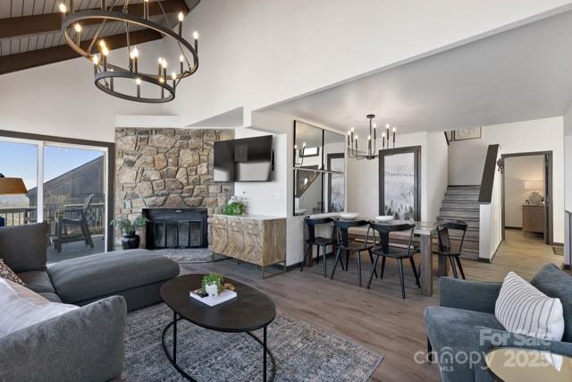 105 Beechtop Road Beech Mountain, NC 28604 - Photo 37 of 42 a living room with furniture a fireplace and a flat screen tv