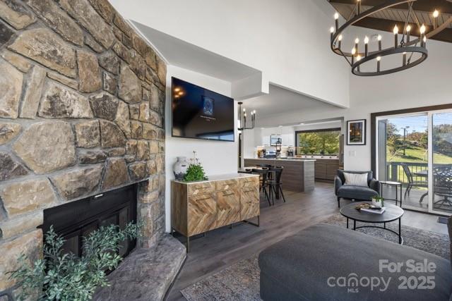 105 Beechtop Road Beech Mountain, NC 28604 - Photo 38 of 42 a living room with fireplace furniture and a flat screen tv
