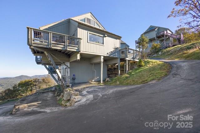 105 Beechtop Road Beech Mountain, NC 28604 - Photo 40 of 42 a front view of a house with a yard