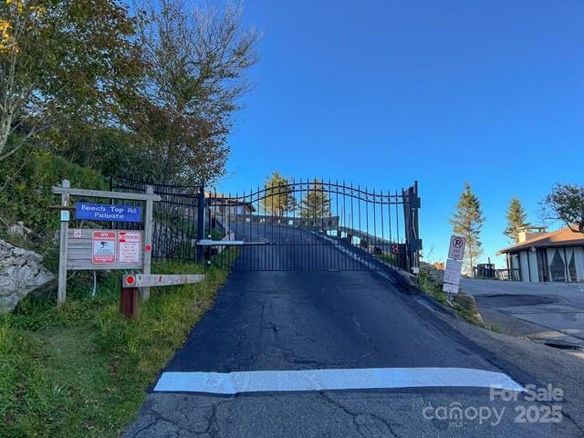 105 Beechtop Road Beech Mountain, NC 28604 - Photo 42 of 42 a view of a street with a bench and trees