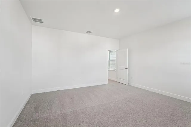 a bathroom with a double vanity sink and mirror