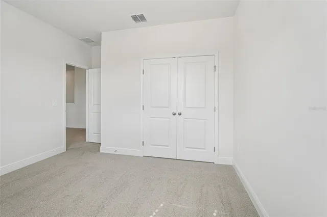 a bathroom with a bathtub shower sink vanity mirror and toilet