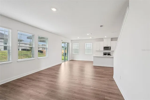 a view of kitchen and wooden floor