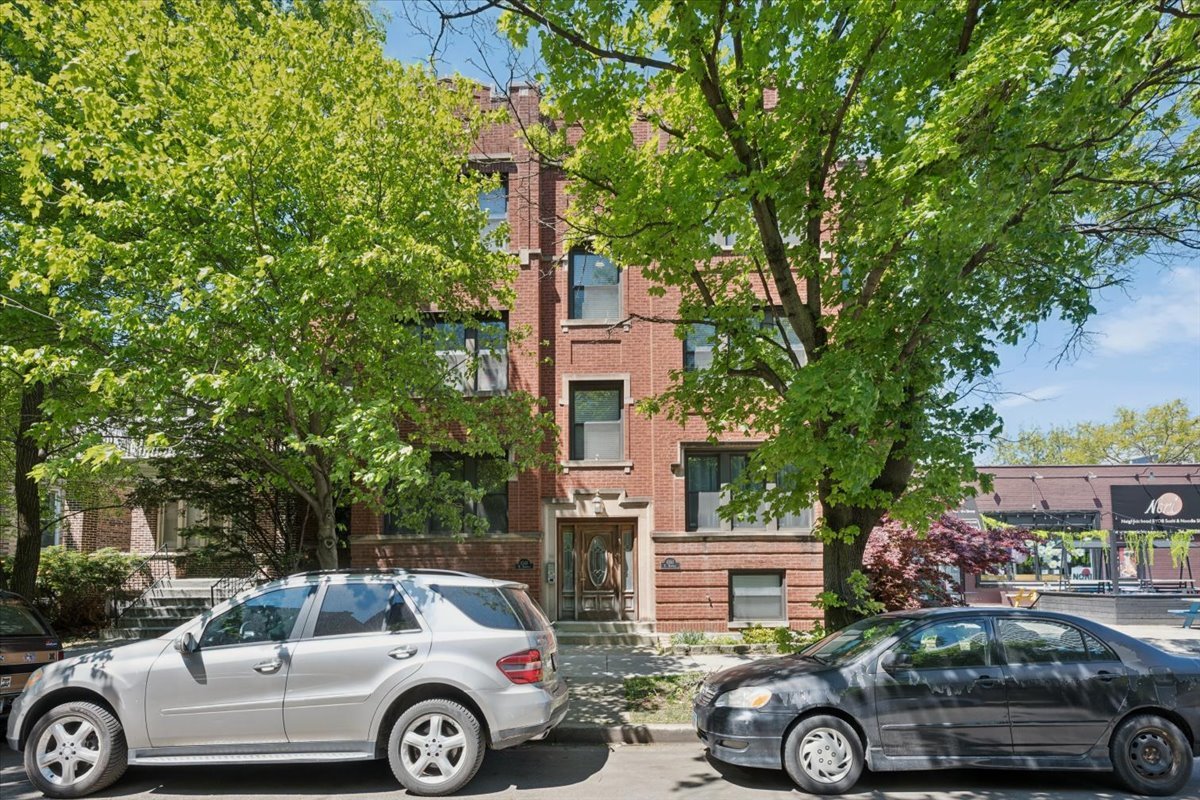 6348 North Magnolia Avenue, Unit 3 Chicago, IL 60660 - Photo 1 of 19 a front view of a house with parking space