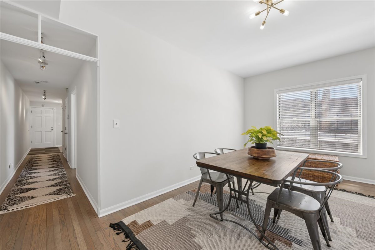 6348 North Magnolia Avenue, Unit 3 Chicago, IL 60660 - Photo 12 of 19 a view of a dining room with furniture and a window