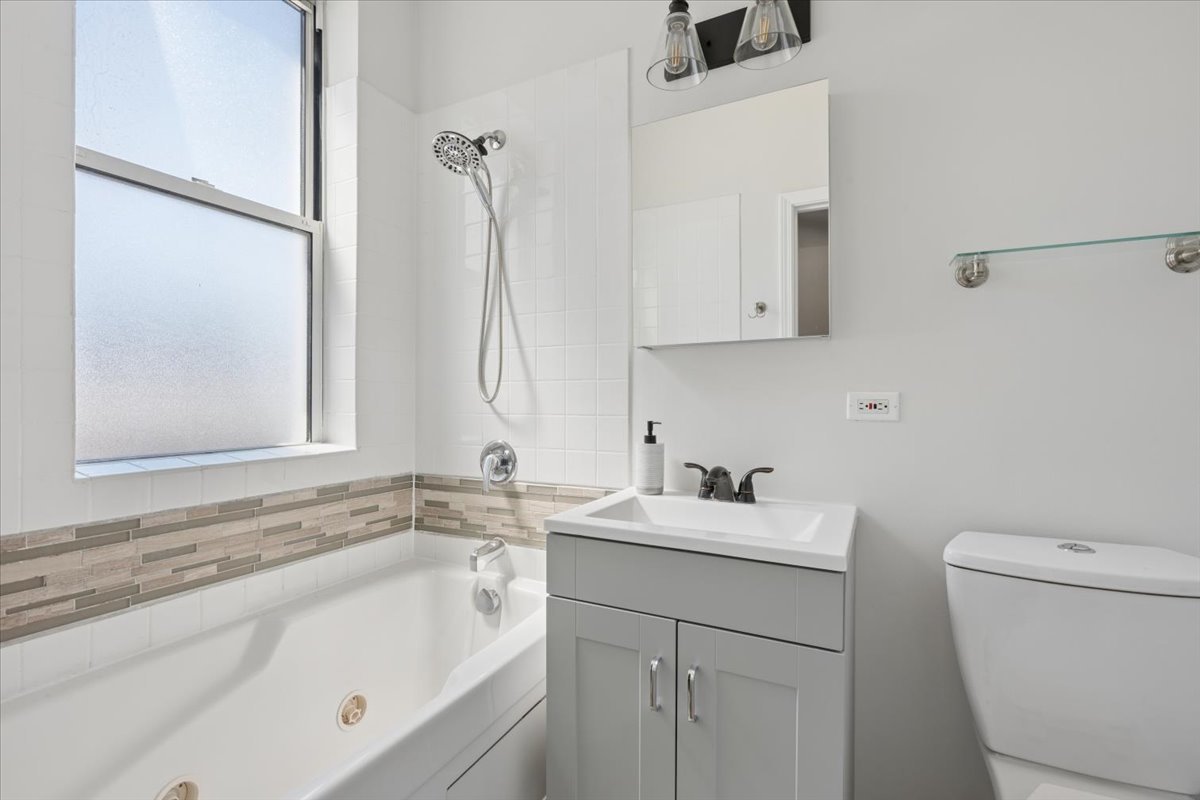 6348 North Magnolia Avenue, Unit 3 Chicago, IL 60660 - Photo 8 of 19 a bathroom with a sink and a toilet