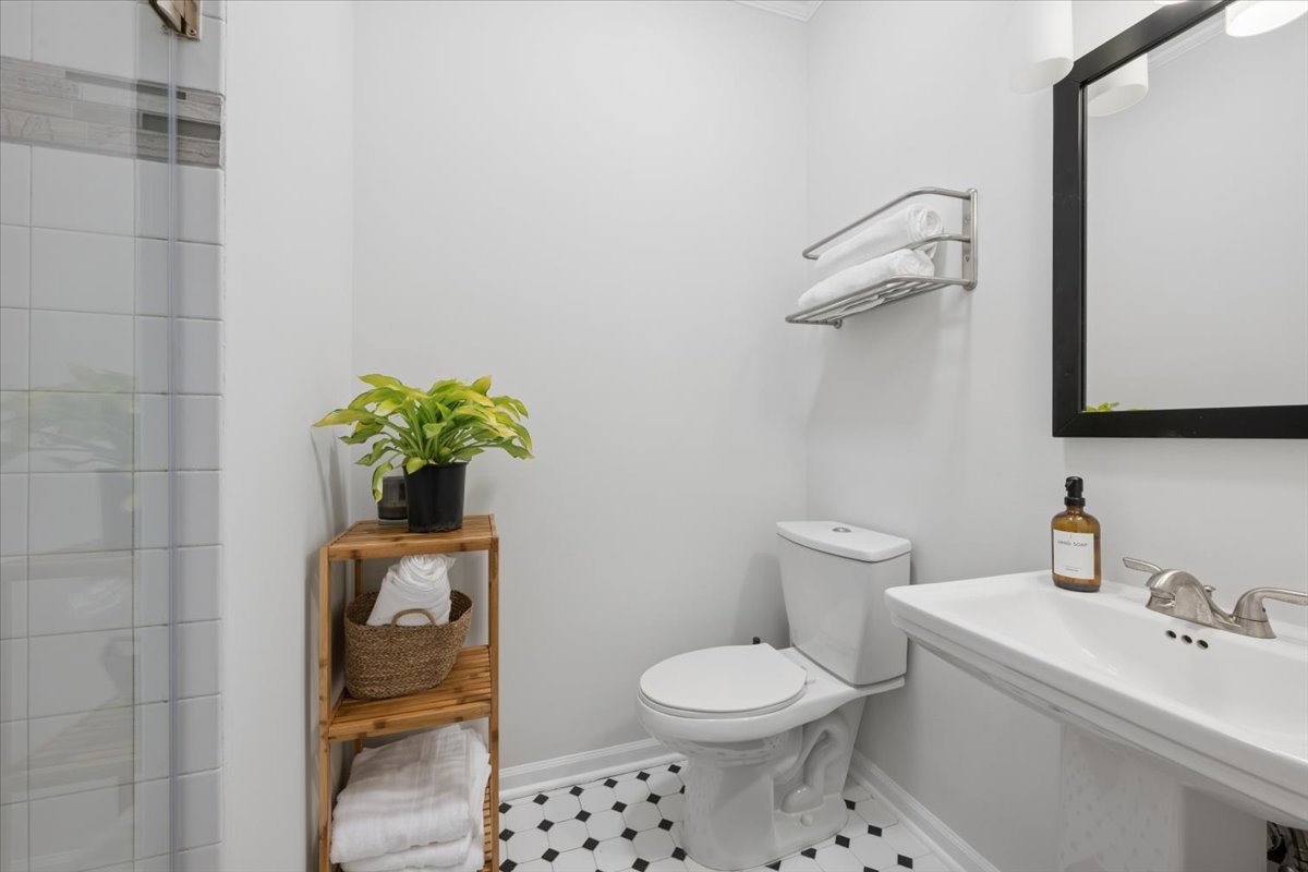6348 North Magnolia Avenue, Unit 3 Chicago, IL 60660 - Photo 9 of 19 a bathroom with a toilet sink and mirror
