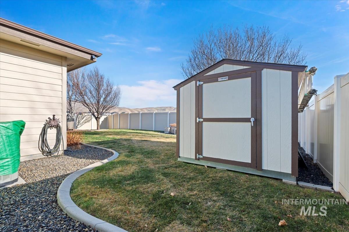 8014 South Bogus Ridge Way Boise, ID 83716 - Photo 4 of 44 View of shed featuring a fenced backyard