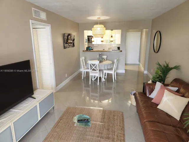 a kitchen with a sink and a refrigerator