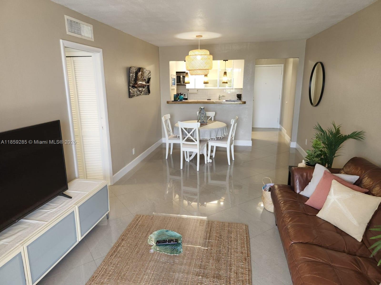 88500 Overseas Highway, Unit 301 Islamorada, FL 33036 - Photo 14 of 24 a view of a dining room with furniture
