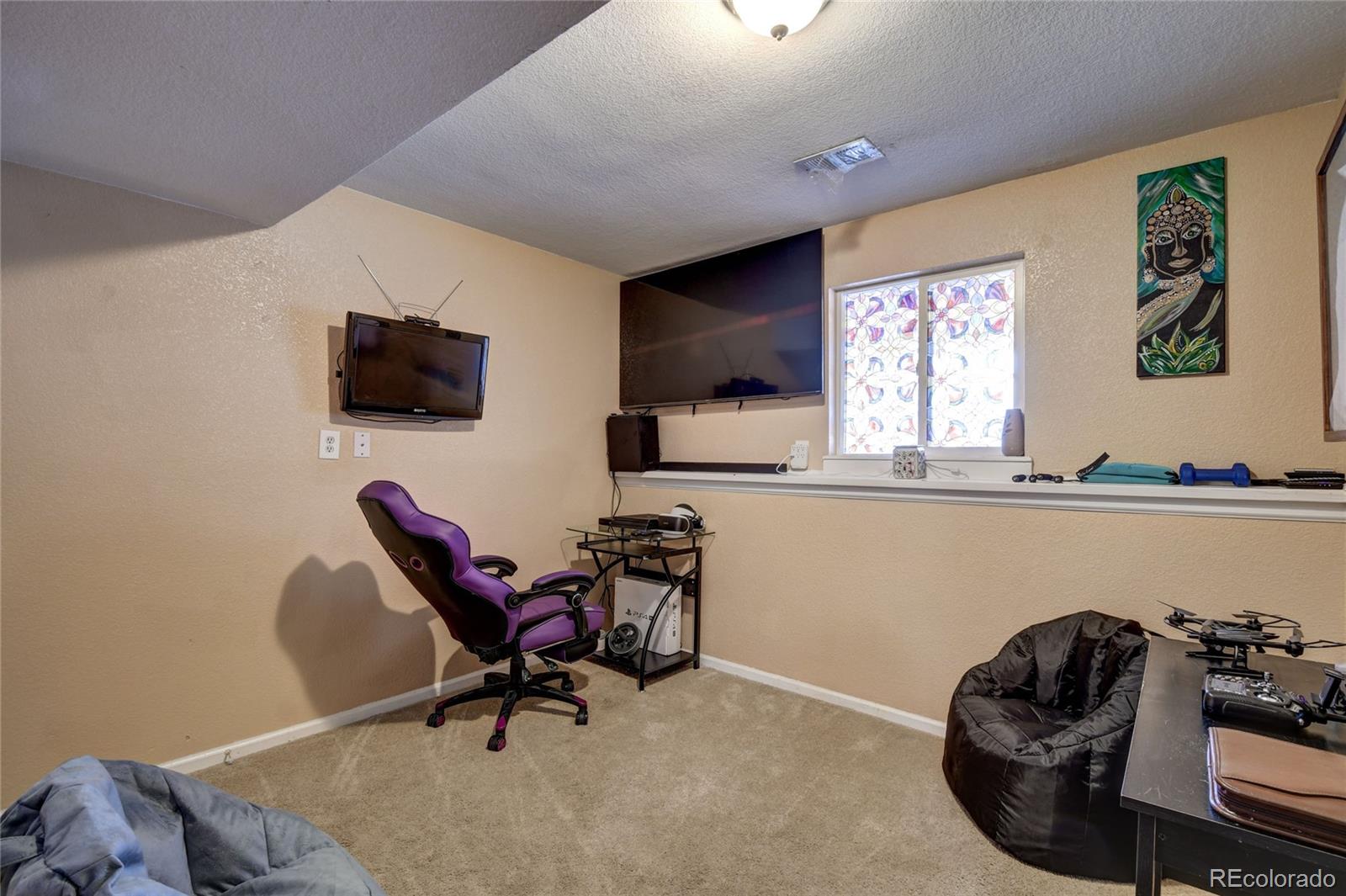 820 South Denver Avenue Fort Lupton, CO 80621 - Photo 16 of 40 a work room with furniture and windows